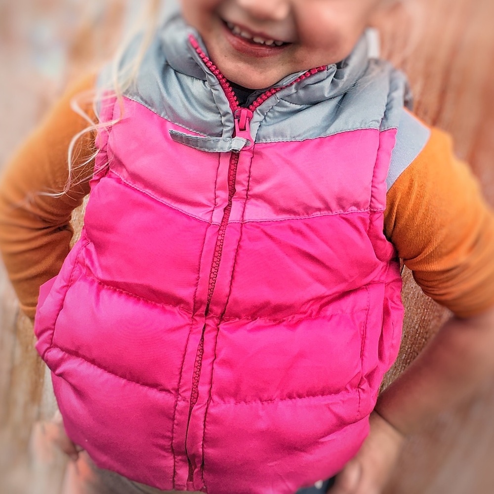 Size 2T “One Step Up” two-tone pink puffer vest.